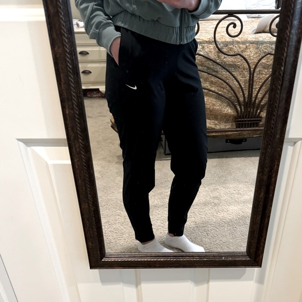 Nike Dri-Fit joggers. Look brand new! Very lightweight. Elastic waist band.